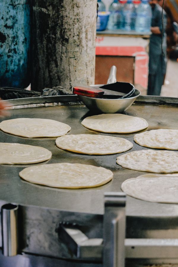 Chicken paratha folded and griddled on the tawa
