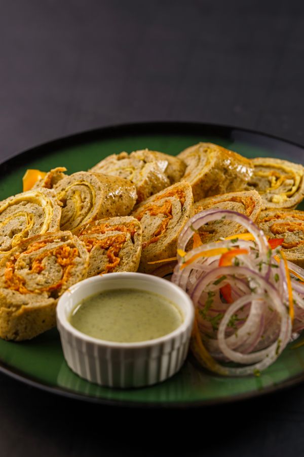 Egg chatni roll wrapped with mint and tamarind chutney