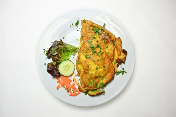 Omelette folded into paratha with cheese